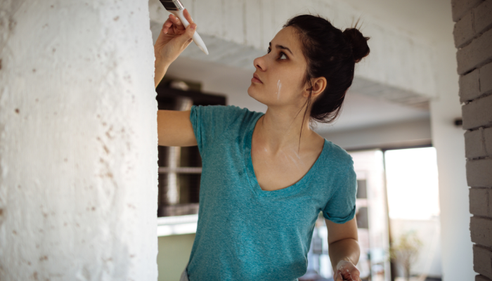 Woman painting a property interior