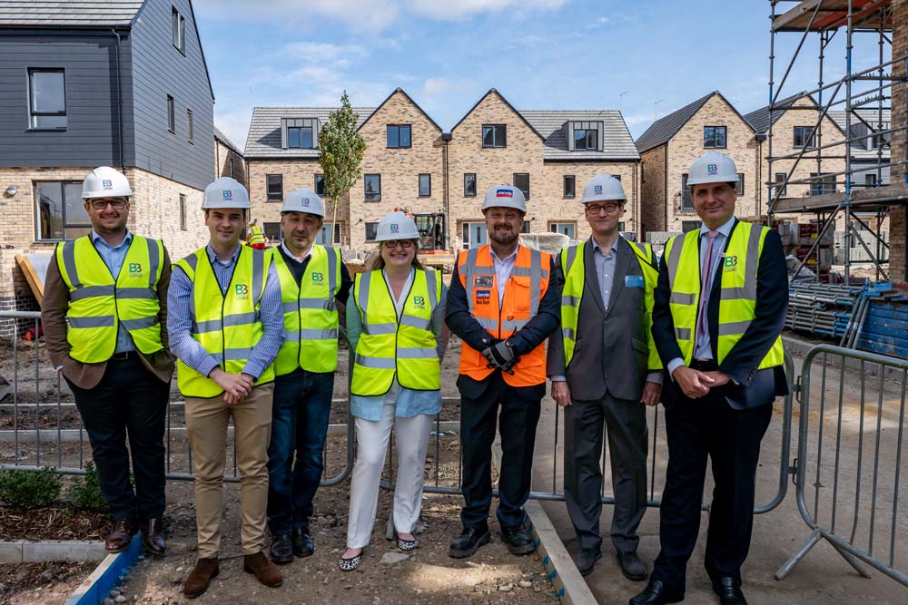 Photo showing stakeholders from B3Living, Broxbourne Council and Jarvis in hard hats on the Oaklands development