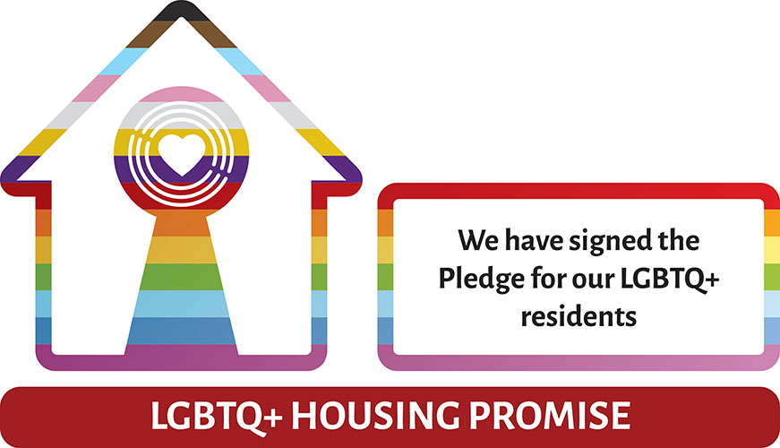 LGBTQ+ Housing Promise. An outline of a house in rainbow colours with a keyhole shaped design with a heart in the middle. On the side, there is text reading: We have signed the Pledge for our LGBTQ+ residents
