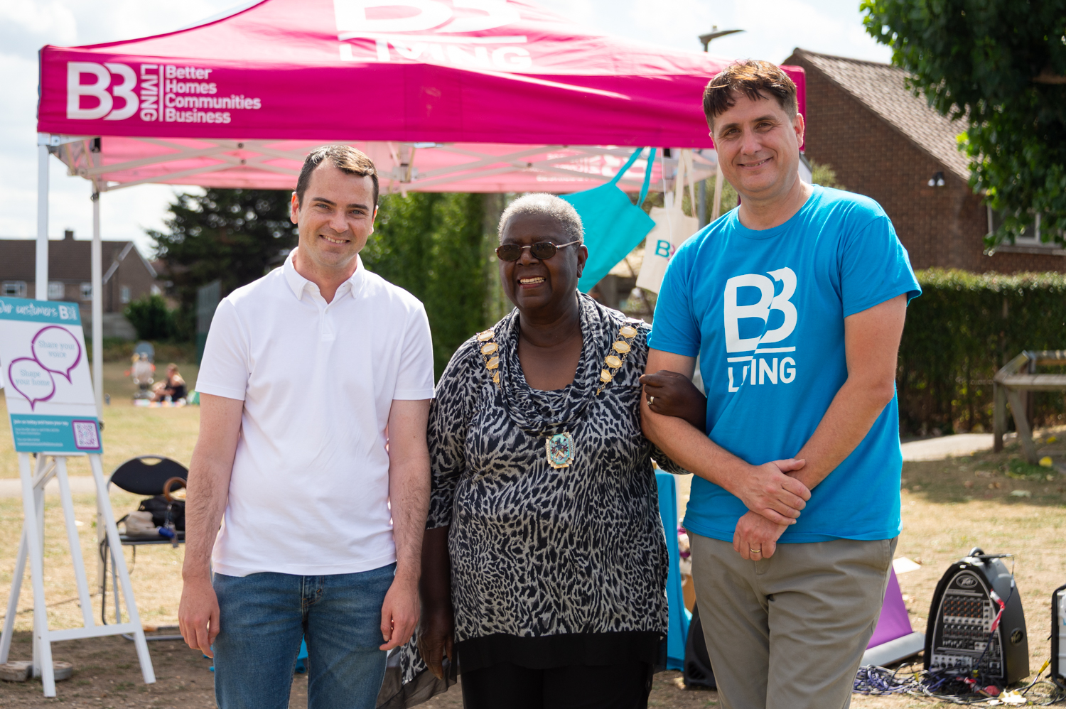 Lewis Cocking MP, Mayor Patsy Spears and Steve Woodcock standing in front of a B3Living tent and smiling at the camera